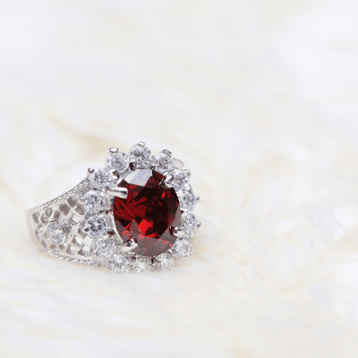 Ruby diamond halo ring Ruby in diamond halo ring in white gold.