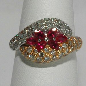 Two-tone 18K gold ruby ring with diamonds.