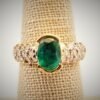 lrgemovalpave.m Large oval emerald 14K gold ring.
