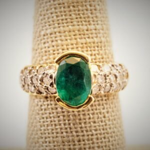 Large oval emerald 14K gold ring.