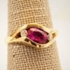 Classic Majesty: Three-Stone Ruby and Diamond Ring in Yellow Gold, Ring size 6.5