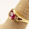 Classic Majesty: Three-Stone Ruby and Diamond Ring in Yellow Gold, Ring size 6.5