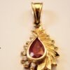 teardrop ruby pendant.f Pear-Shaped Ruby Pendant with Feather Design in 4K Yellow Gold with Diamond